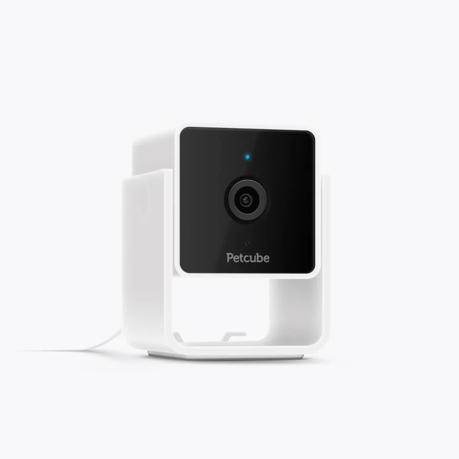 The Petcube Cam as Petcube shows it: a white cube camera with a black lens face on a looped stand, power cable trailing