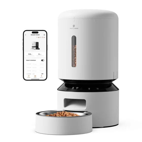 The Petlibro Granary Smart Feeder as Petlibro photographs it: white hopper with a food window, the app screen beside it and kibble in the stainless bowl